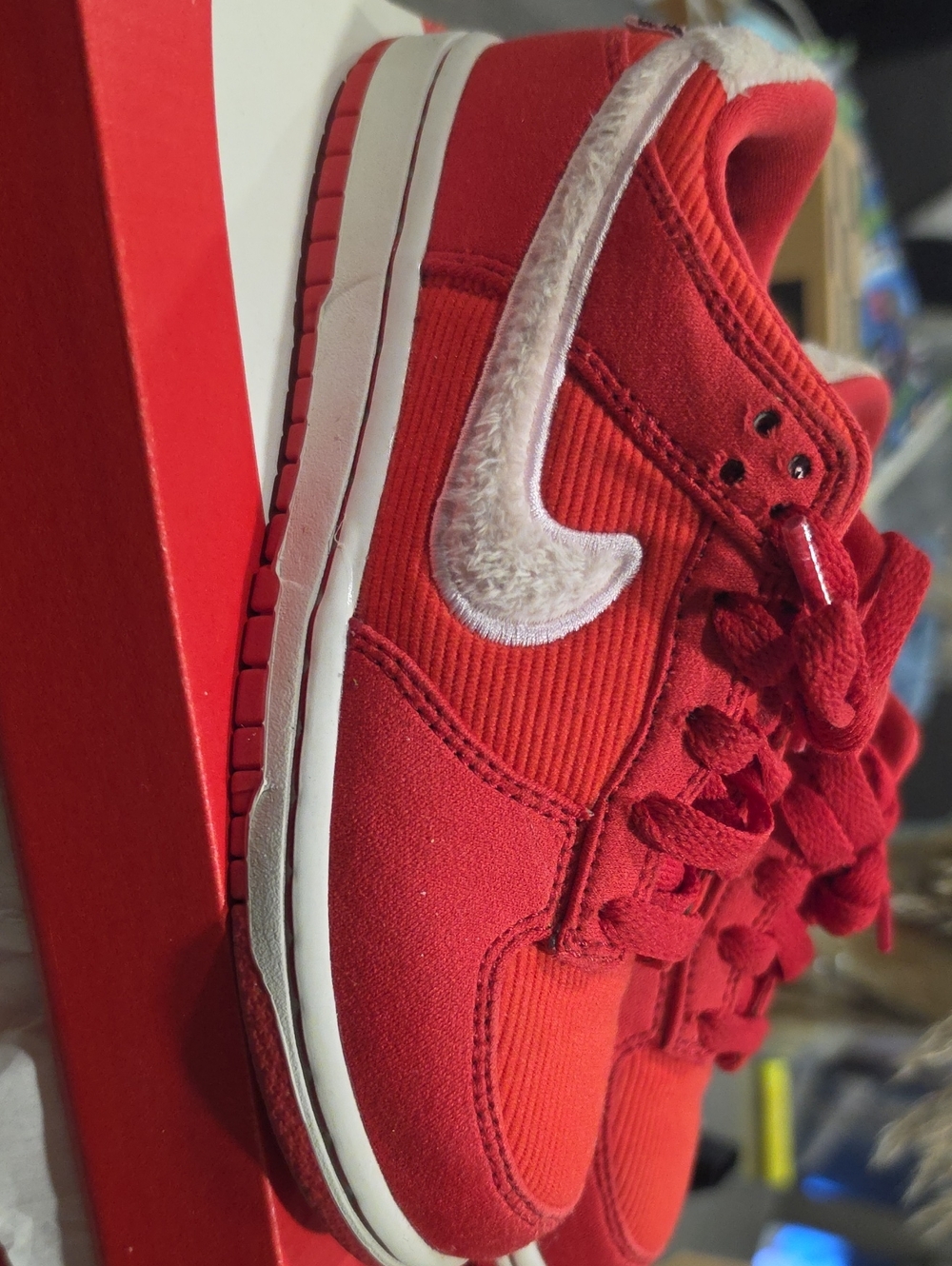 Nike Red Low-Top Kids Sneaker with White Fuzzy Swoosh